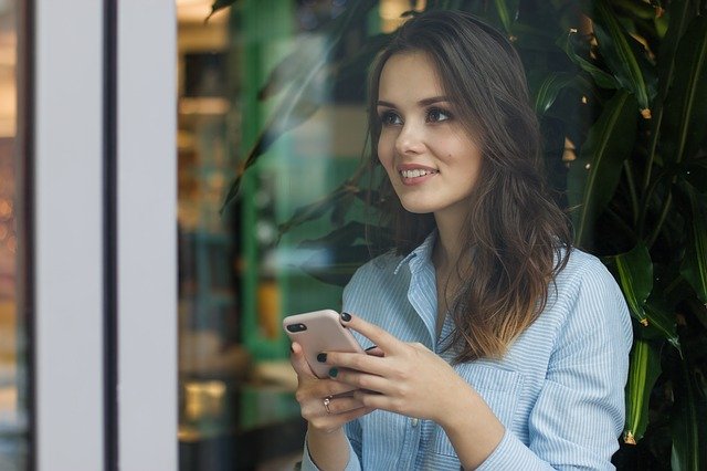 Girl Interacting With Brand On Phone